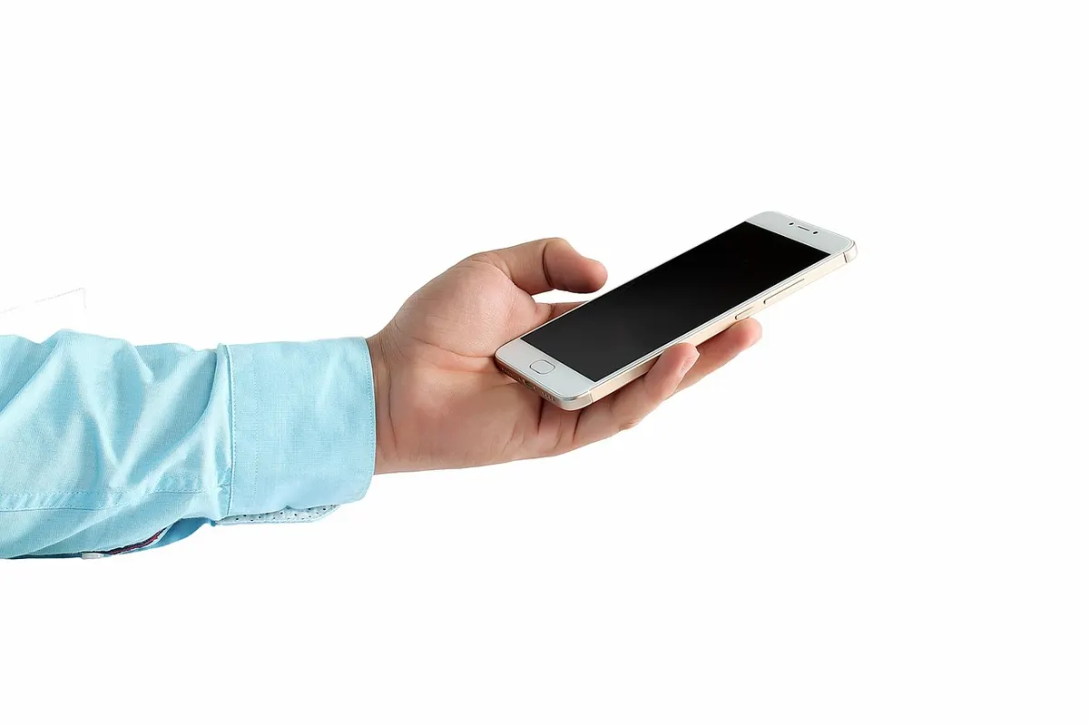 Hand holding a smartphone representing native Android app development