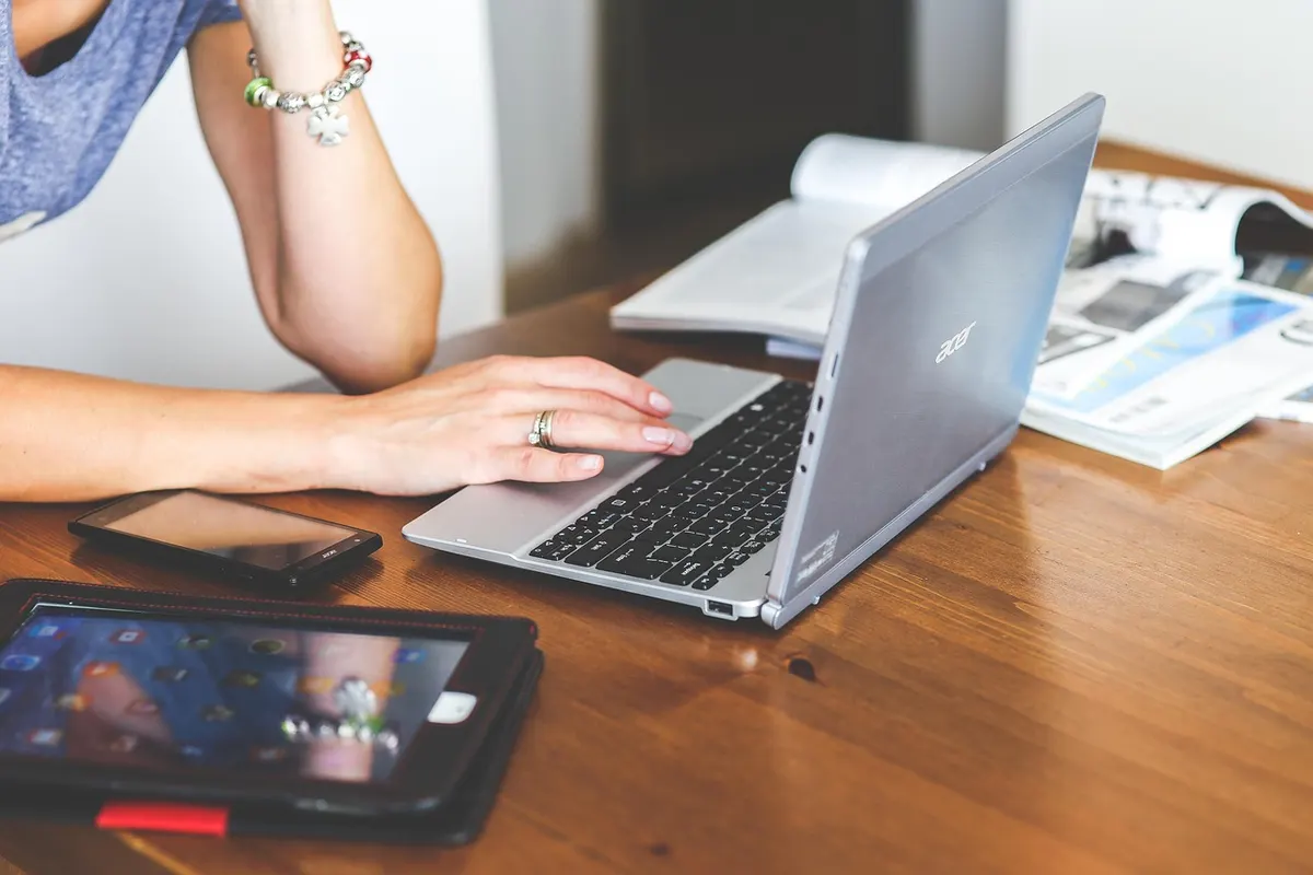 Responsive Web Design Laptop, tablet and smartphone together on a desk illustrating responsive web design