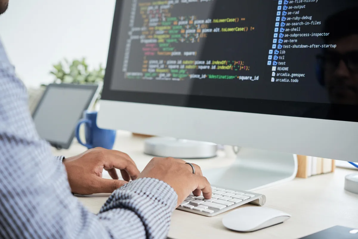 React.js Development Front-end developer building a React.js component library on a laptop