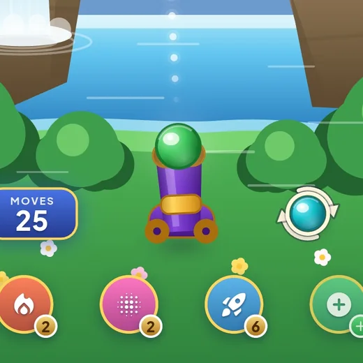 Close-up of the cannon, the next bubble in its swap ring, the moves counter and the booster buttons.