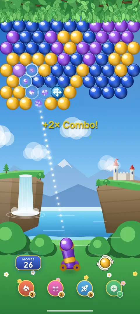 A match 3 combo: bubbles pop on a blue, purple and yellow board while “+2× Combo!” appears above the cannon.